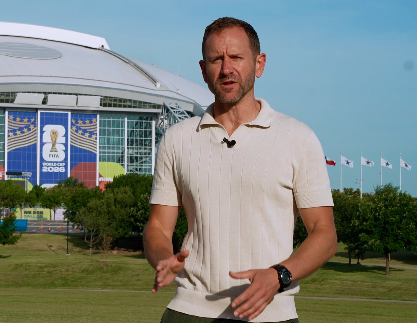 Paul Rhys reporting to camera outside the stadium in Dallas at the 2026 FIFA World Cup