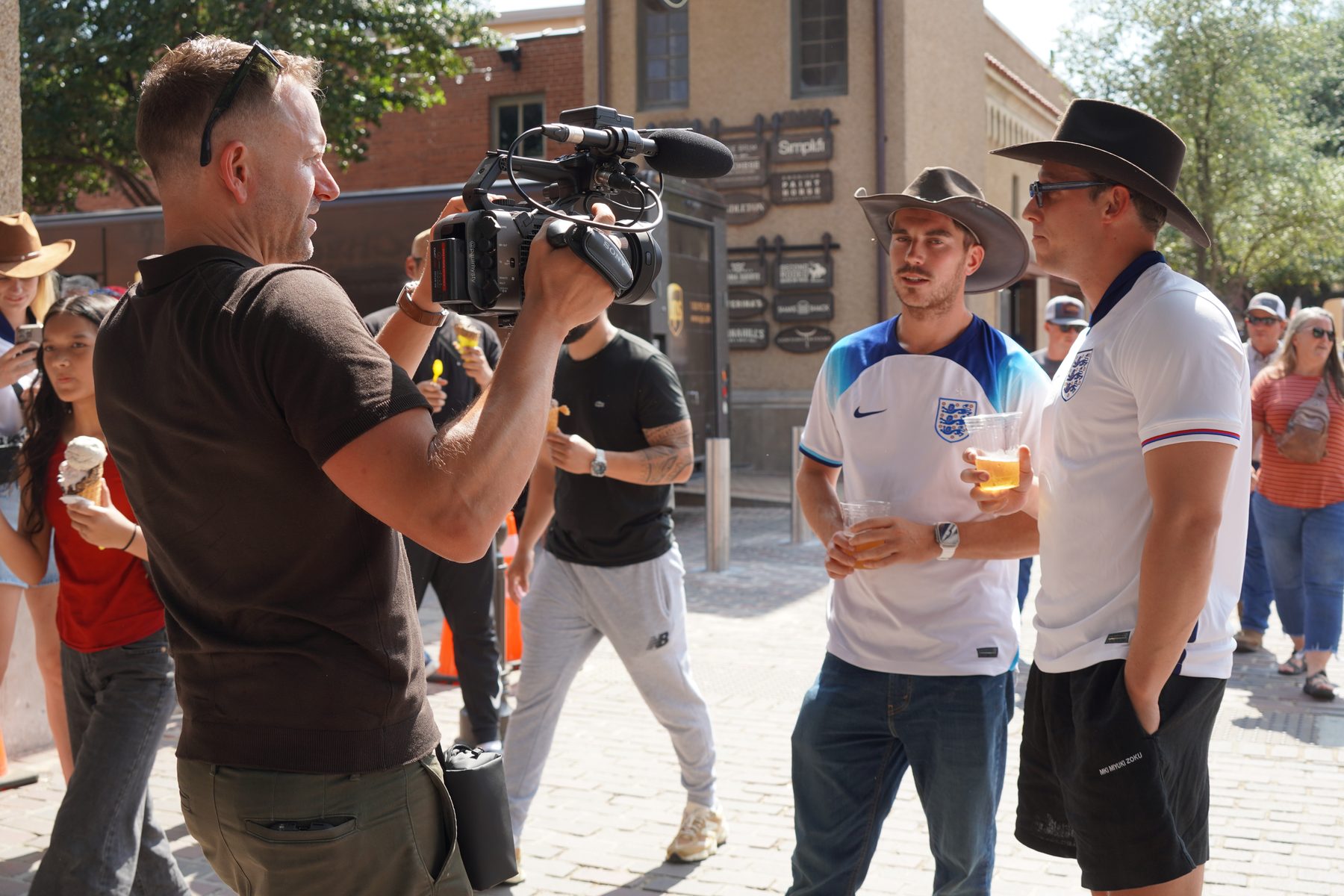 Paul Rhys interviewing England fans in Fort Worth during the 2026 FIFA World Cup